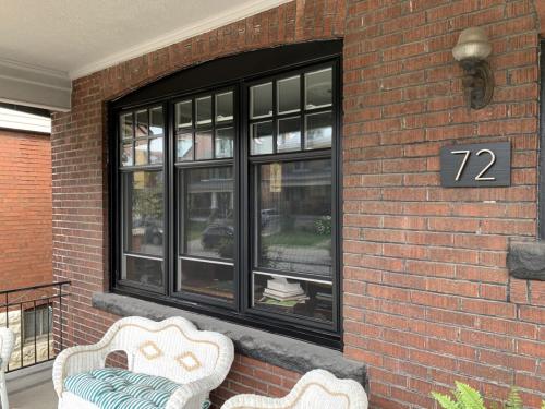 Black casement windows with grill